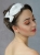 Śnieżnobiała elegancja – opaska ślubna z satyny i piór